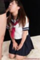 Kogal on her knees in uniform sucking cock head