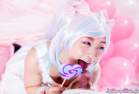 Minano Ai on her knees sucking lolipop and cock